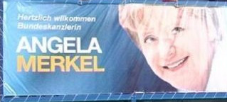 Ангела Меркел на транспаренту у Приштини
